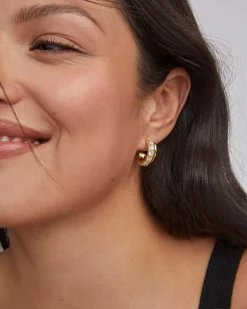 Livy Gold Huggie Earrings in White Crystal